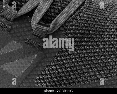 Fragment de sneaker grise avec cordon macro.texture Sneaker Banque D'Images