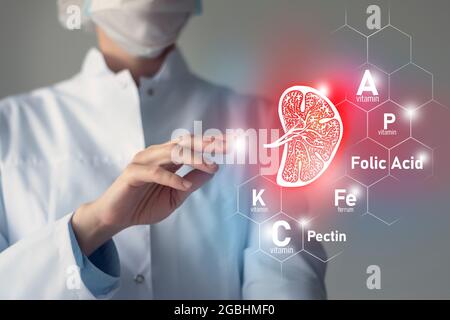 Nutriments essentiels pour la santé de la rate, y compris la pectine, l'acide folique, la vitamine P, le Ferrum. Portrait flou du médecin tenant un dessin esquissé rouge mis en évidence Banque D'Images