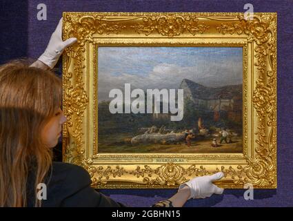 Bonhams, Londres, Royaume-Uni. 4 août 2021. Les garçons jouant au cricket par William Mulready, RA (britannique, 1786-1863) seront proposés à la vente à Bonhams Londres 19e siècle et à la vente d'art impressionniste britannique qui aura lieu le 22 septembre avec une estimation de £8,000-12,000. Il n'a pas été vu depuis les années 1940 et est rare en ce qu'il est tout à fait un tableau de cracketing tôt, peint en 1810, et exposé à la RA en 1813. Image: Bonhams membre du personnel Sasha Thomas avec le travail. Crédit : Malcolm Park/Alay Live News. Banque D'Images