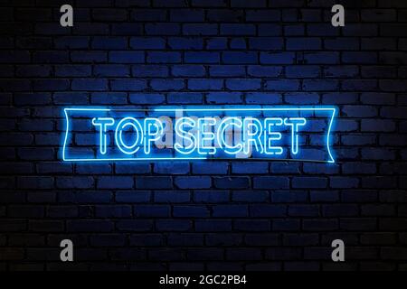Haut Secret néon texte sur mur de brique vide. Enseigne au néon brillant, bannière Banque D'Images