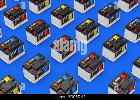 Rangées d'accumulateurs 12 V rechargeables avec étiquette abstraite sur fond bleu. Rendu 3d Banque D'Images