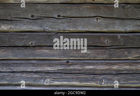 Vue de face d'un vieux mur en bois, vieux et abîmé.Arrière-plan abstrait plein cadre texturé. Banque D'Images