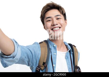 Jeune étudiant à l'université prenant le selfie Banque D'Images