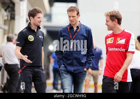 (De gauche à droite): Romain Grosjean (FRA) Lotus F1 Team avec Alex Wurz (AUT) Williams Driver Mentor / GPDA Président et Sebastian Vettel (GER) Ferrari. Grand Prix brésilien, vendredi 13 novembre 2015. Sao Paulo, Brésil. Banque D'Images