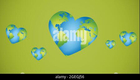 Composition de plusieurs globes en forme de cœur sur fond vert Banque D'Images