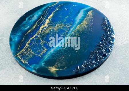 Peinture d'art en résine. Composition d'art époxy avec des couleurs bleues et de la pierre Banque D'Images