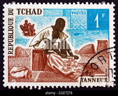 TCHAD - VERS 1970: Un timbre imprimé au Tchad montre Tanner, occupation, vers 1970 Banque D'Images