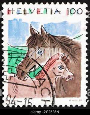 SUISSE - VERS 1993 : un timbre imprimé en Suisse montre chevaux, Equus Ferus caballus, Animal, vers 1993 Banque D'Images