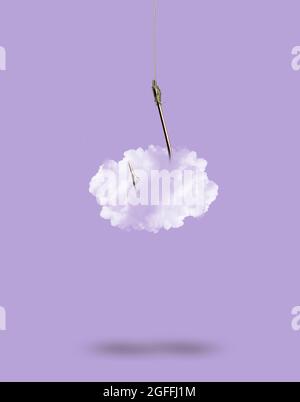 Nuage attaché à un crochet de pêche Banque D'Images