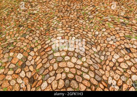 Vieille rue dans un quartier médiéval. Motif pavé. Banque D'Images