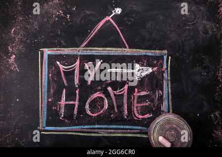 Soumission de la maison écrite, avec la craie sur le tableau noir Banque D'Images