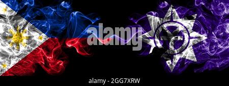 Philippines, Philippines vs Japon, Japonais, Okayama drapeaux de fumée côte à côte. Banque D'Images