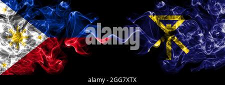 Philippines, Philippines vs Japon, Japonais, Osaka drapeaux de fumée côte à côte. Banque D'Images