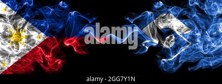 Philippines, Philippines vs Japon, Japonais, Shizuoka drapeaux de fumée côte à côte. Banque D'Images