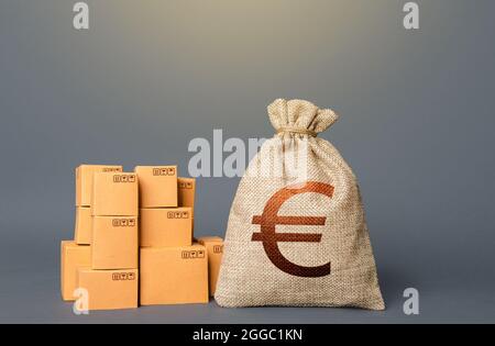 Boîtes et Euro Money bag. Le concept du commerce des biens et de la production. Secteur des affaires. Livraison. Bénéfice de la négociation. Succès financier. PIB et Banque D'Images