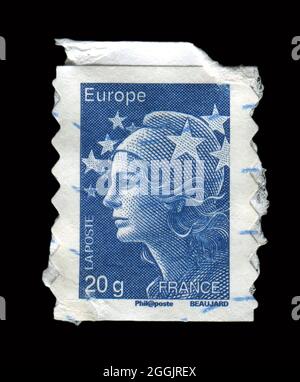 Le timbre imprimé en France montre l'image de la fille. Banque D'Images