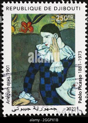 Arlequin assis par Pablo Picasso sur un timbre-poste Banque D'Images
