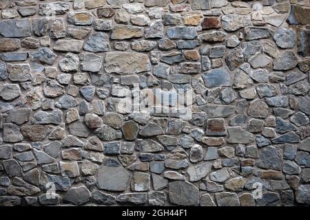 Vieux mur de matériaux naturels en blocs de granit pour la conception graphique Banque D'Images