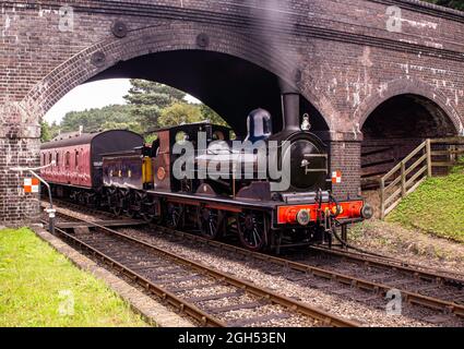 Great Eastern Railway 0-6-0 no 564 départ de la gare de Weybourne avec un train jusqu'à l'arrêt Banque D'Images