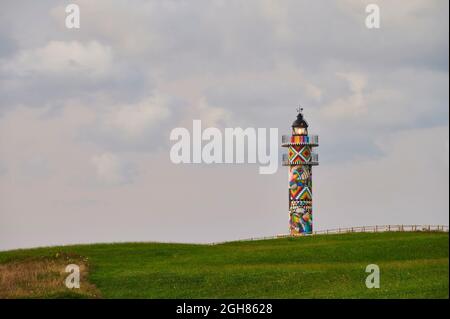 Phare de Cabo de Ajo peint par le peintre Okuda San Miguel, spécialisé en Art urbain Ajo, Municipalité de Bareyo, Cantabrie, Mer de Cantabrique, Espagne, Banque D'Images