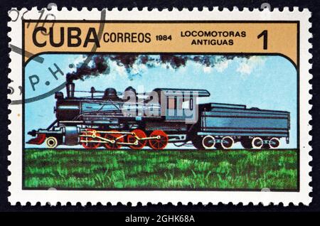 CUBA - VERS 1984 : un timbre imprimé à Cuba montre une locomotive ancienne, vers 1984 Banque D'Images