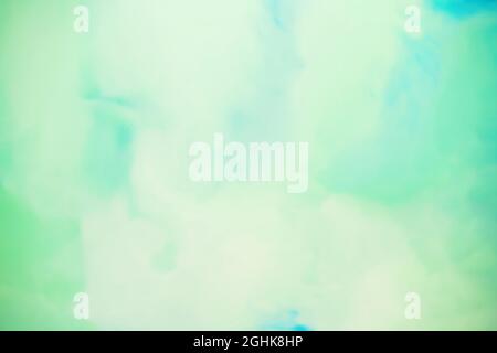 Fond de peinture texturé abstrait plein cadre avec taches d'aquarelle diffuses vertes et jaunes Banque D'Images