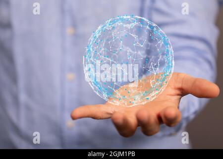 Photo d'un homme d'affaires utilisant la modélisation de réseau de données 3D avec ses doigts Banque D'Images