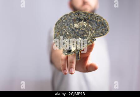 Photo d'une main humaine atteignant un modèle 3D d'un concept de cerveau artificiel sur fond blanc Banque D'Images