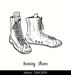 Chaussures de boxe. Dessin d'une boisée noire et blanche à l'encre. Banque D'Images