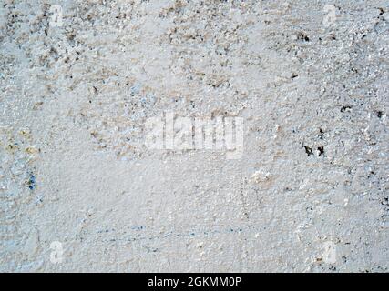 Le fond ou la texture du mur peint en béton fissuré. Gros plan Banque D'Images