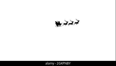 Image numérique de la silhouette noire du père noël et de l'arbre de noël en traîneau Banque D'Images