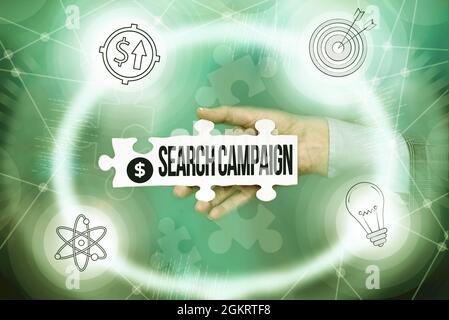 Texte montrant la campagne de recherche d'inspiration. Mot écrit sur la méthode de placer des annonces en ligne sur les pages Web main tenant Jigsaw Puzzle Piece Banque D'Images