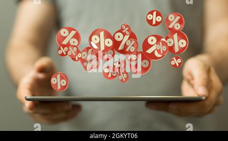 rendu 3d des symboles de pourcentage blancs sur les bureaux circulaires rouges flottant au-dessus d'une tablette dans les mains humaines Banque D'Images