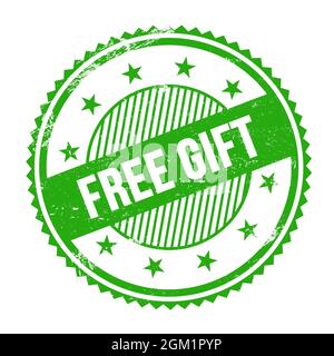 Texte CADEAU GRATUIT écrit sur un timbre rond vert grungy à bordures en zigzag. Banque D'Images