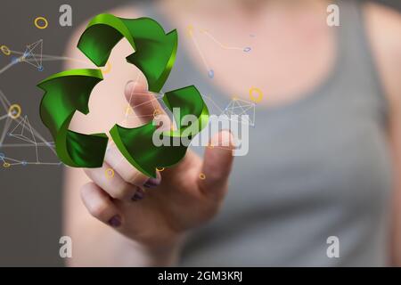 rendu 3d de flèches vertes symbole du concept d'entreprise de recyclage exploité par une main de femme Banque D'Images