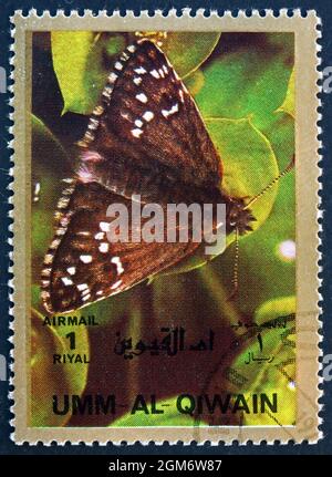 UMM AL-QUWAIN - VERS 1972 : un timbre imprimé dans l'Umm al-Quwain montre Butterfly, insecte, vers 1972 Banque D'Images