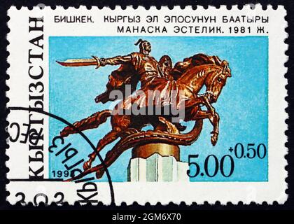 KIRGHIZISTAN - VERS 1993 : un timbre imprimé au Kirghizistan montre la statue de Manas héros d'Epic, Bichkek, vers 1993 Banque D'Images