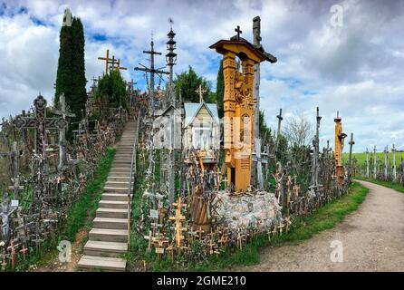 The Hill of Crosses - a site of pilgrimage in northern Lithuania. Over the generations, crosses, crucifixes, statues of the Virgin Mary and thousands Stock Photo