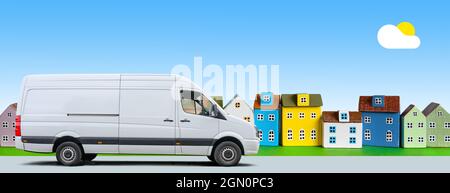 Un minibus blanc se déplace le long d'une rangée de maisons miniatures colorées sur fond bleu ciel Banque D'Images