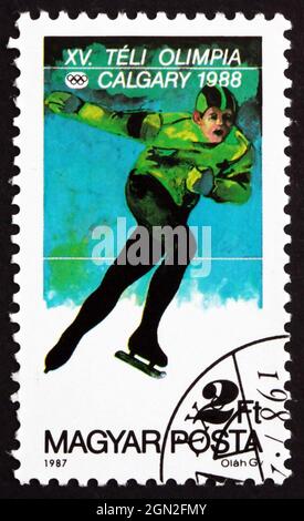 Hongrie - circa 1987 : timbre imprimé dans la Hongrie affiche le patinage de vitesse, Jeux Olympiques d'hiver de 1988, Calgary, Canada, vers 1987 Banque D'Images