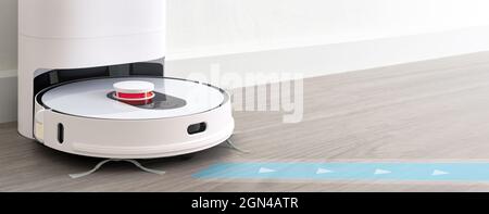 aspirateur robotique sur parquet technologie de nettoyage intelligente Banque D'Images