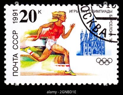 RUSSIE, URSS - VERS 1991: Timbre-poste de l'URSS montrant Runner aux XXV Jeux Olympiques de Sport Barcelone 1992 Banque D'Images