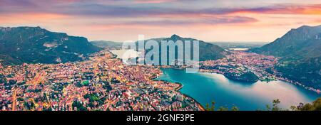 Scène estivale panoramique du lac de Côme. Paysage urbain nocturne aérien de la ville de Lecco avec le mont Resegone en arrière-plan, Italie, Europe. Concept de voyage back Banque D'Images