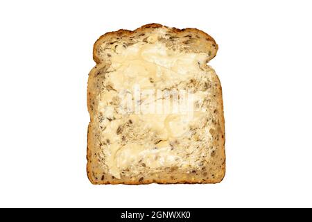 Pain et beurre coupés en tranches de wholemeal qui a des avantages santé de petit déjeuner coupé et isolé sur un fond blanc, gros plan studio photo ima Banque D'Images