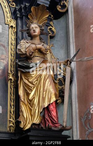 Saint Apollonia sur l'autel de Sainte Anne dans l'église paroissiale de Saint Wolfgang sur Wolfgangsee en Autriche Banque D'Images