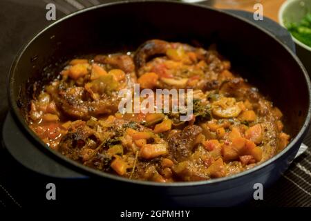 Veal shanks braised in vegetable in pan Stock Photo