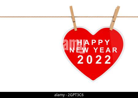 Cœur en papier rouge avec affiche « Happy New Year 2022 » suspendue sur une corde sur fond blanc. Rendu 3d Banque D'Images