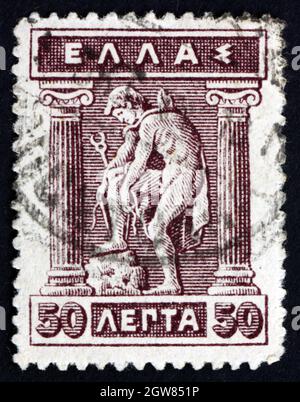 GRÈCE - VERS 1911: Un timbre imprimé en Grèce montre Hermes donnant des Sandals, Hermes est un Dieu olympique dans la mythologie grecque, vers 1911 Banque D'Images