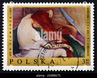 POLOGNE - VERS 1969: Un timbre imprimé en Pologne montre femme peignant ses cheveux, peinture par Wladyslaw Slewinski, vers 1969 Banque D'Images