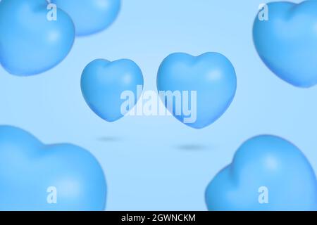 Idée créative avec de nombreux coeurs flottants dans l'air sur fond bleu pastel. Symbole minimal d'amour pour les femmes heureuses, les mères, la Saint-Valentin, bir Banque D'Images